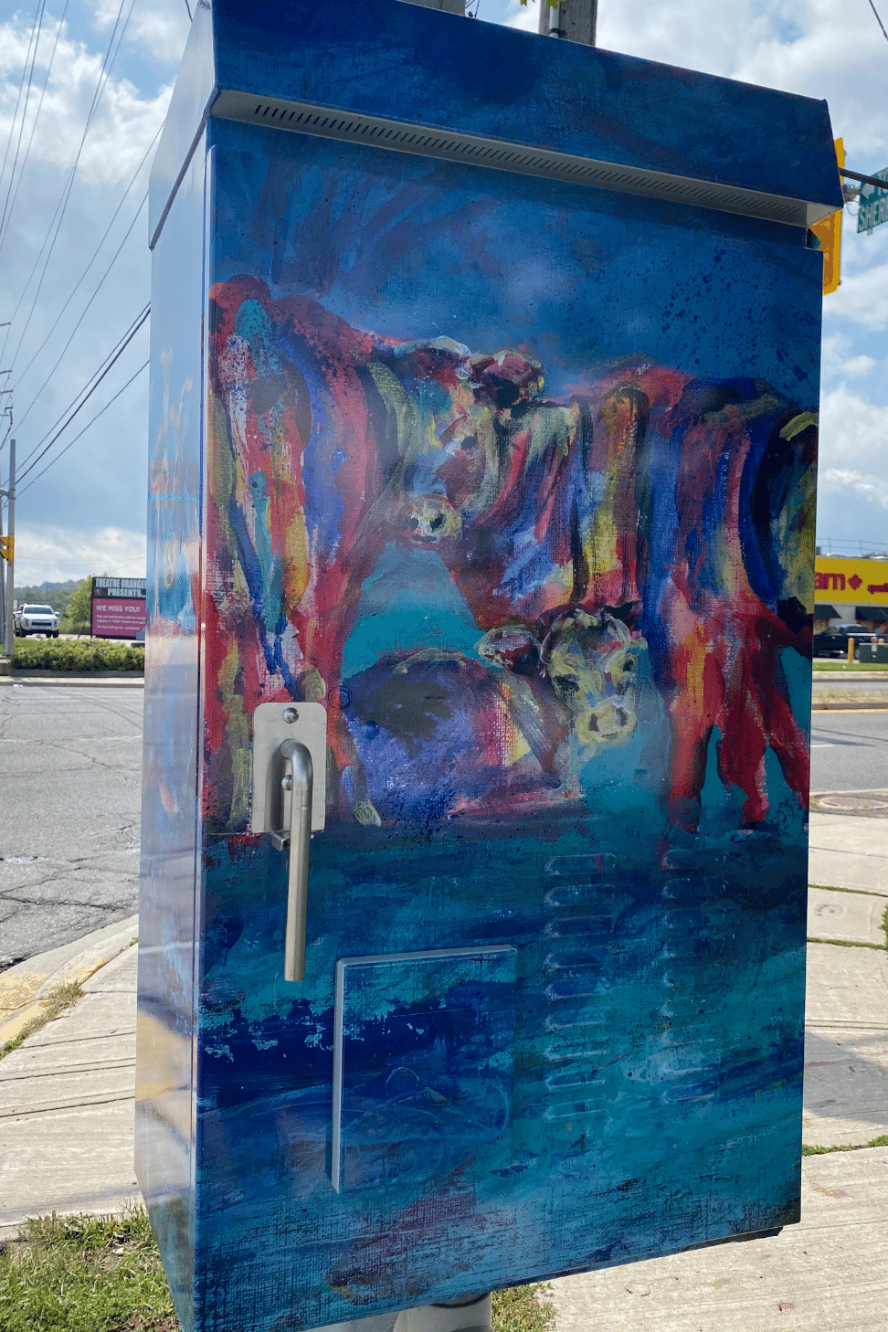 Utility box with artwork of bovines